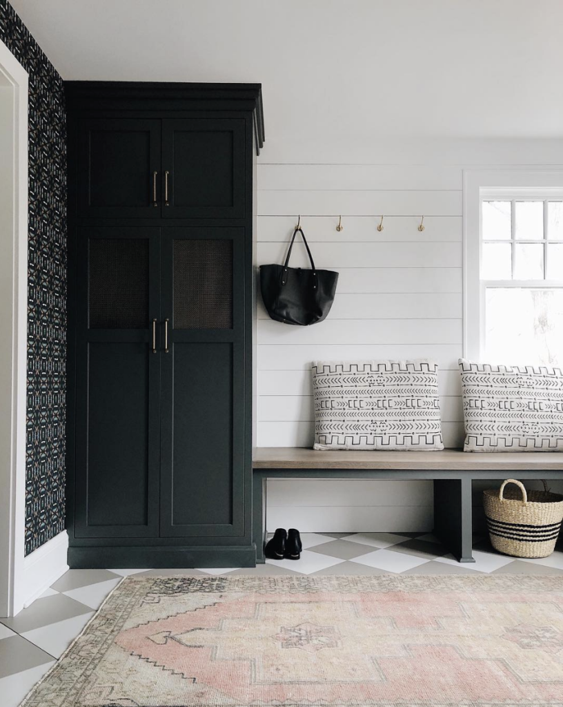 mudroom wallpaper dark cabinets patterned floor shiplap boho style